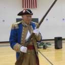 David Ramseur with musket at Greenwood School