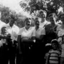 Picture of Ivan & Maud's children and grandchildren. 1954--In front of Joyce & Lester Bartlett's home. Left to right Ivan, (2nd wife Pearl, who he divorced later,)  Thad, Art holding Arleta, Darlene & Shirley Buckner, Teddy,  Wilma Buckner,  Joyce Bartlett,  Lester Bartlett,  Ronnie--in front : Tommy, Barry, Chuck & Sam Bartlett.