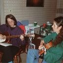 Em Chitty, Marjorie 1990. In this photo my cousin Em got out her guitar and sang with me. We were spending Christmas at my brother Rob's house, when he and his wife hester, with their young son Nate, lived in Chatham, MA. This was when I had only recently started performing as a storyteller/singer. It gave me great joy to be able to sing and play with Em!
