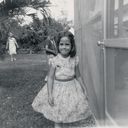 Marjorie, Coral Gables 1961. The look on my face is one I'm very familiar with--my granddaughter, Nicole assumes exactly this expression when she feels tricked. It tickles me that this "look' has carried into anther generation! This was taken in my grandparent's back yard in Coral Gables, Florida. Probably at Easter--this is the kind of Easter dress I would have worn. If it was Easter, we were in the middle of our Easter egg hunt, staged out doors, of course, since the weather was so balmy and there were so many delightful places to tuck hard boiled, colored Easter eggs. We didn't hunt for eggs once, we gave each person a chance to hide them, and my siblings and I gamely searched repeatedly for the colored eggs, hidden in the middle of small palm trees, under bushes, tucked behind lawn furniture and more.