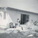 4852 NW 2nd court, Plantation, FL back yard 1965. That's me, Marjorie, on our then new back porch, newly built, since there was no screened porch covering the patio slab. We moved to Plantation in 1960 to a 4-bedroom house, where my parent's 4th child Beth was born that fall (Oct. 1960.) After our youngest brother Rob was born in 1963 the house felt even smaller, so my parents decided to enclose the carport to create an additional 5th bedroom and play area (and 3rd bathroom). When I was growing up the yard was quite sandy, with very few plantings. It was after the kids left home that my parents turned this barebones yard into a tropical arboretum, which featured at least 150 different tropical species of plants and citrus trees.